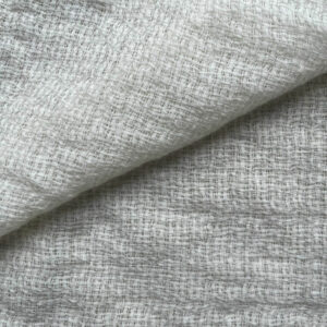 Close-up view of soft and warm 100% wool fabric with a medium density weave, available by the meter.