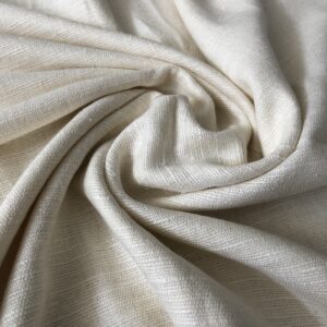 Close-up view of soft, wild silk fabric showcasing its natural variations and slightly uneven weave with an undyed ecru color.