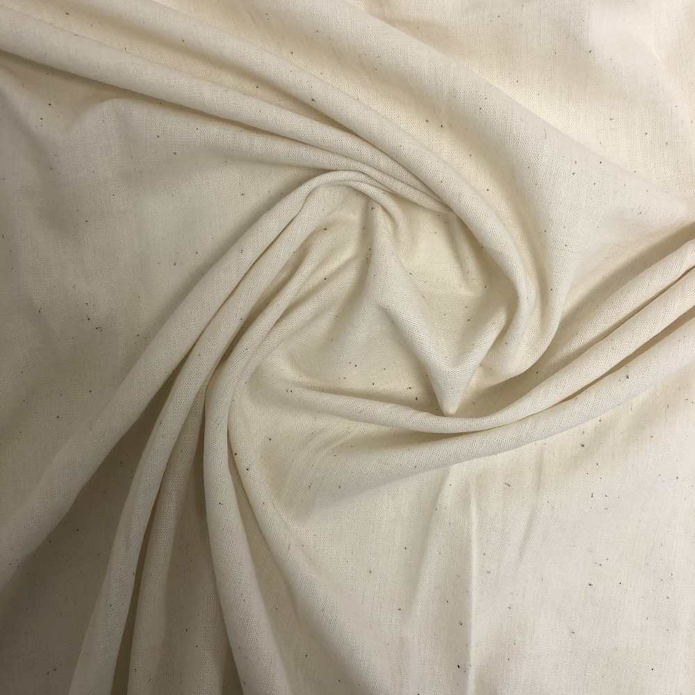 Close-up view of handwoven Khadi cotton fabric with a soft texture, medium weight, and plain weave structure