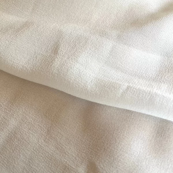 Discover the captivating beauty of silk georgette fabric! Crafted from 100% mulberry silk, this lightweight material boasts a luxurious texture, soft drape, and a touch of transparency.